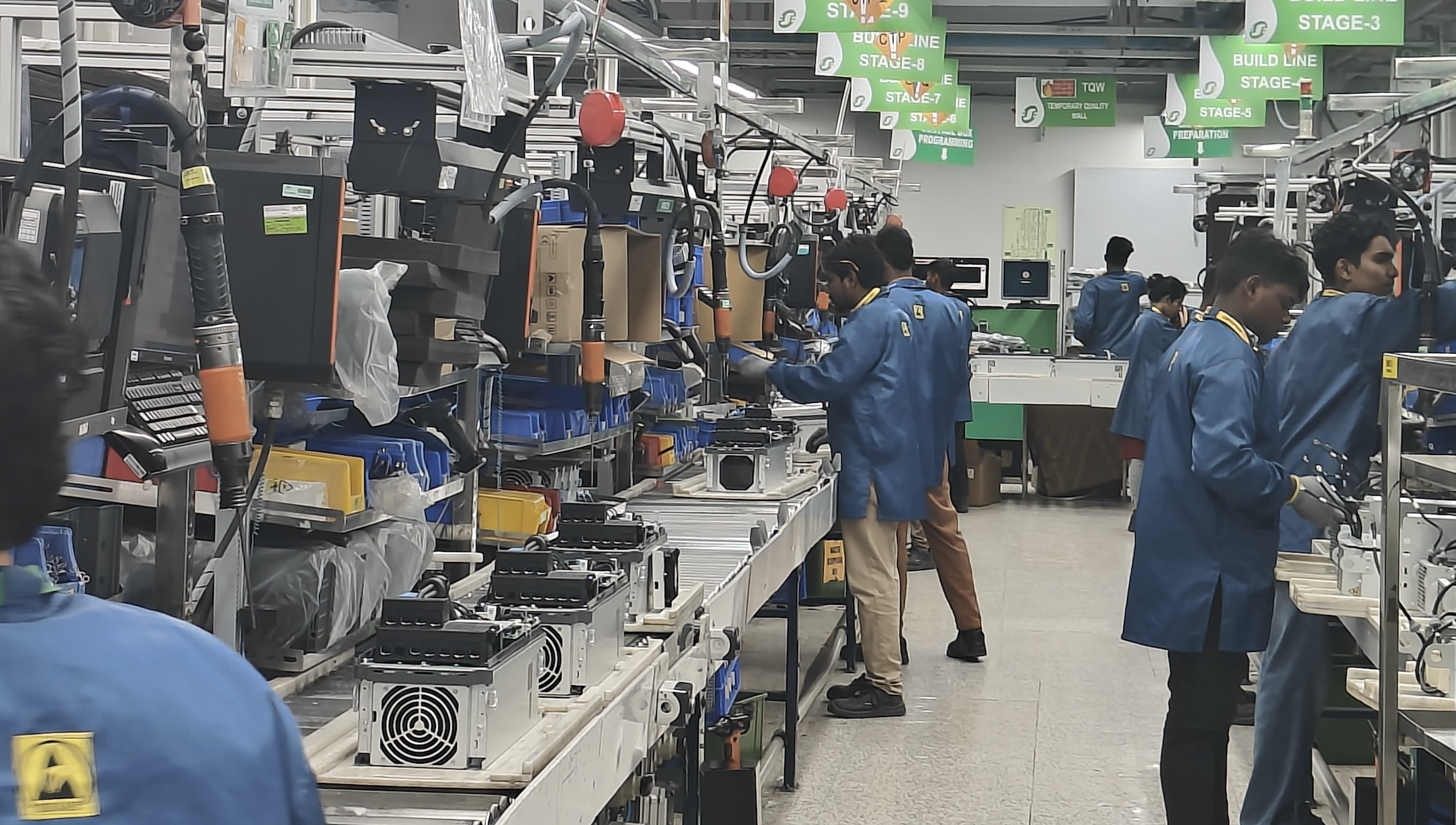Assembly Workers in Production Plant in India